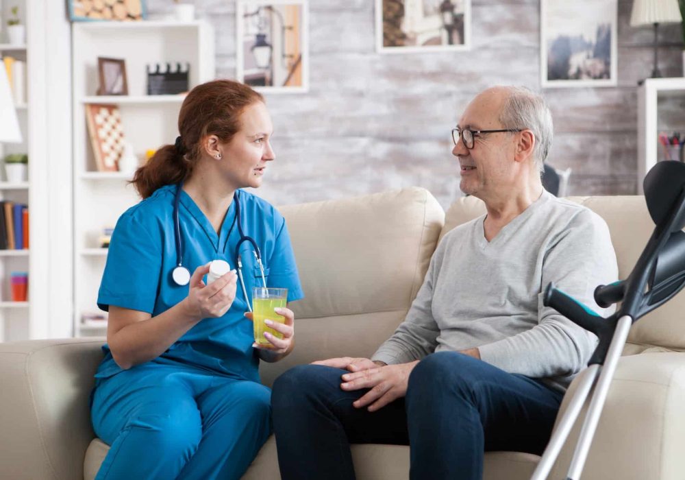 senior-man-in-nursing-home-smiling-to-the-nurse.jpg